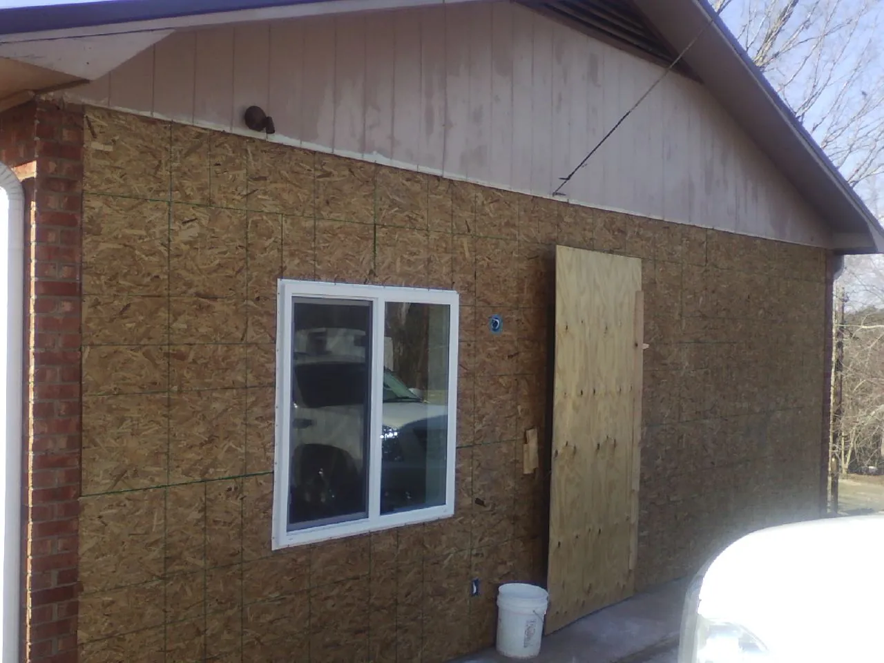OSB sheathing on a garage addition wall before siding in Soap Lake